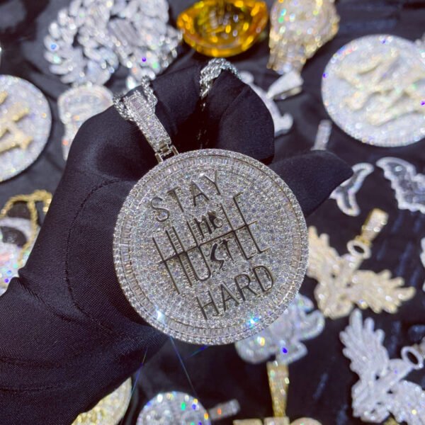 White pendant held in hand, iced out coin pendant for men, statement necklace.